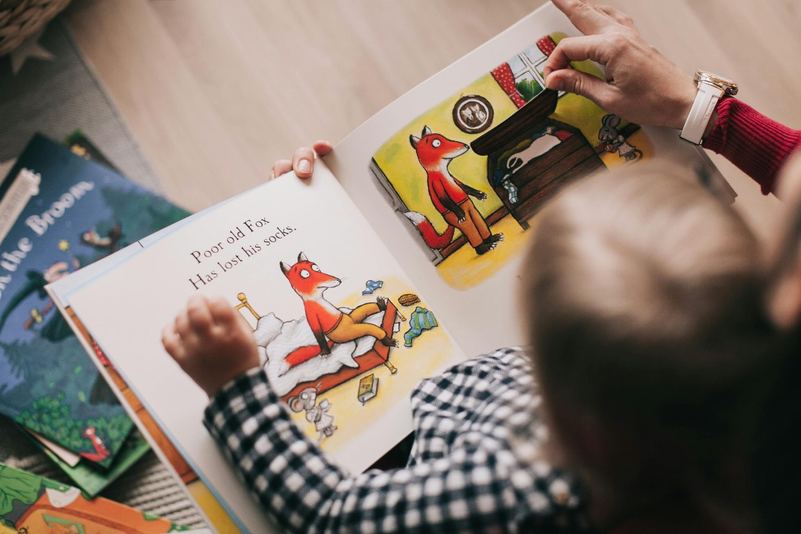 Photo by Lina Kivaka: https://www.pexels.com/photo/person-reading-a-book-1741230/
